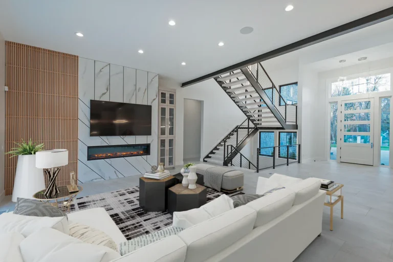 AI virtual staging luxury living room with modern furniture marble fireplace wall and floating staircase showcasing photorealistic interior design