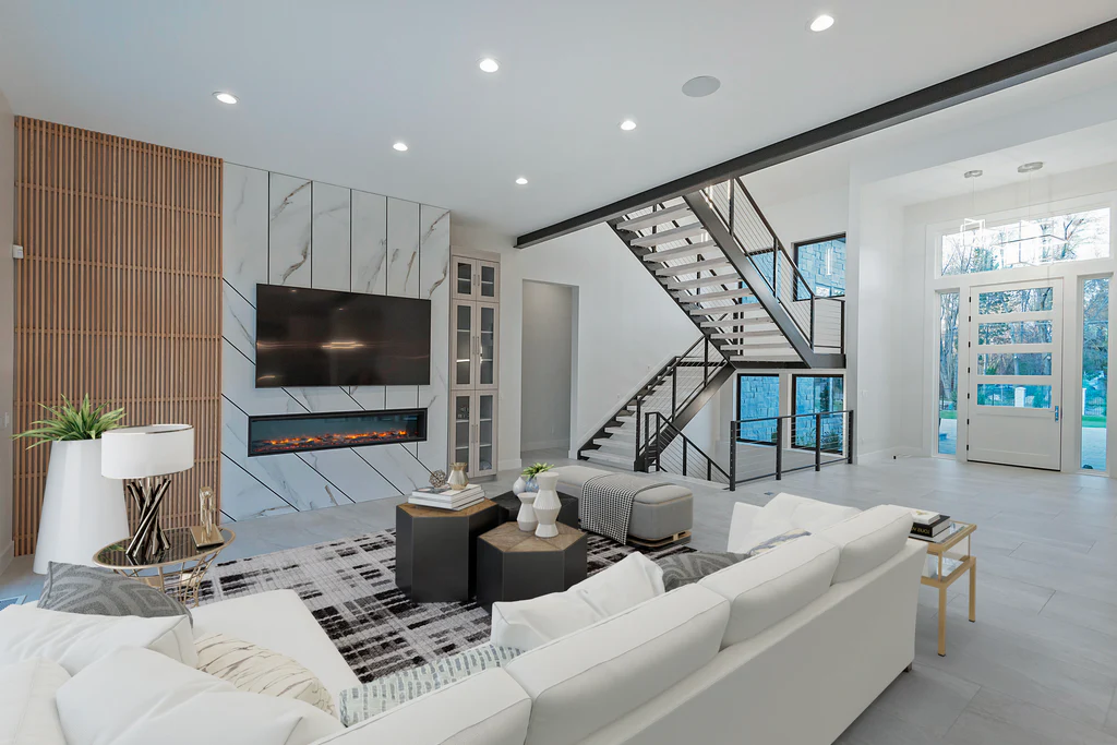 AI virtual staging luxury living room with modern furniture marble fireplace wall and floating staircase showcasing photorealistic interior design