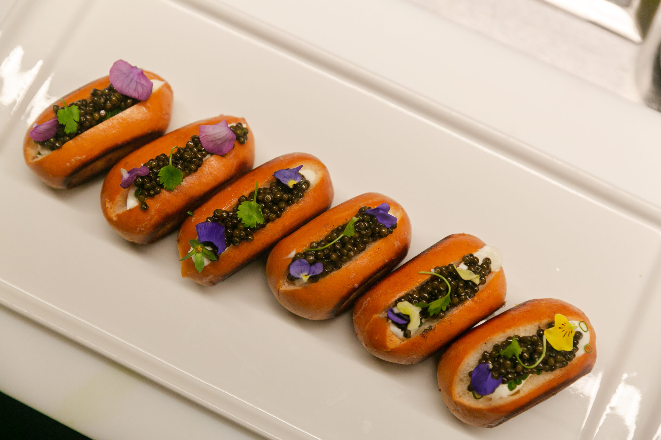 Saltie Girl caviar brioche rolls with creme fraiche and edible flowers Back Bay Boston