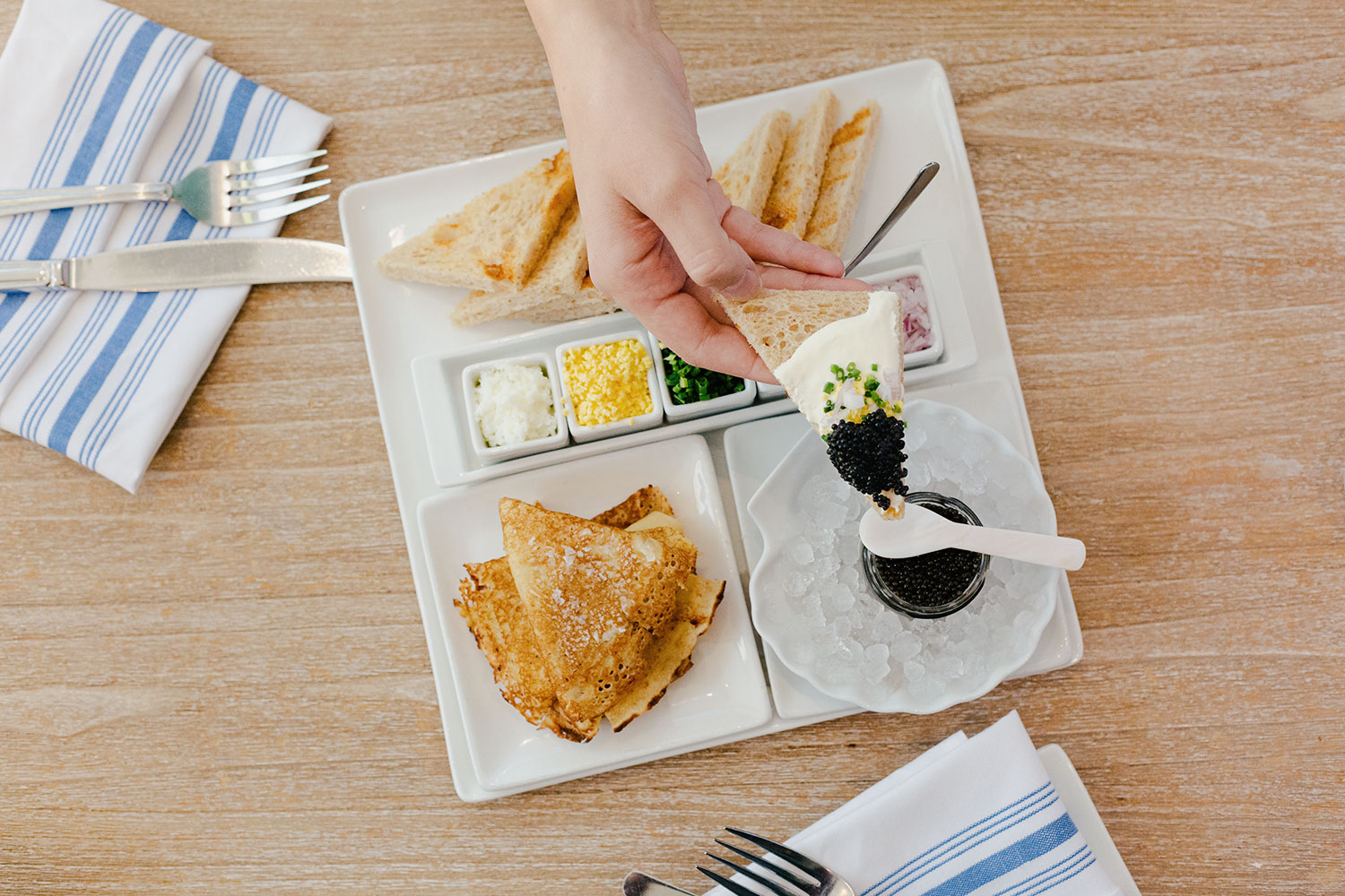 Saltie Girl caviar service with blini and accompaniments Back Bay Boston