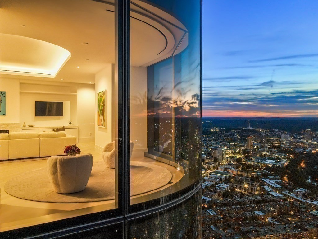 One Dalton Penthouse Corner Living Room at Dusk