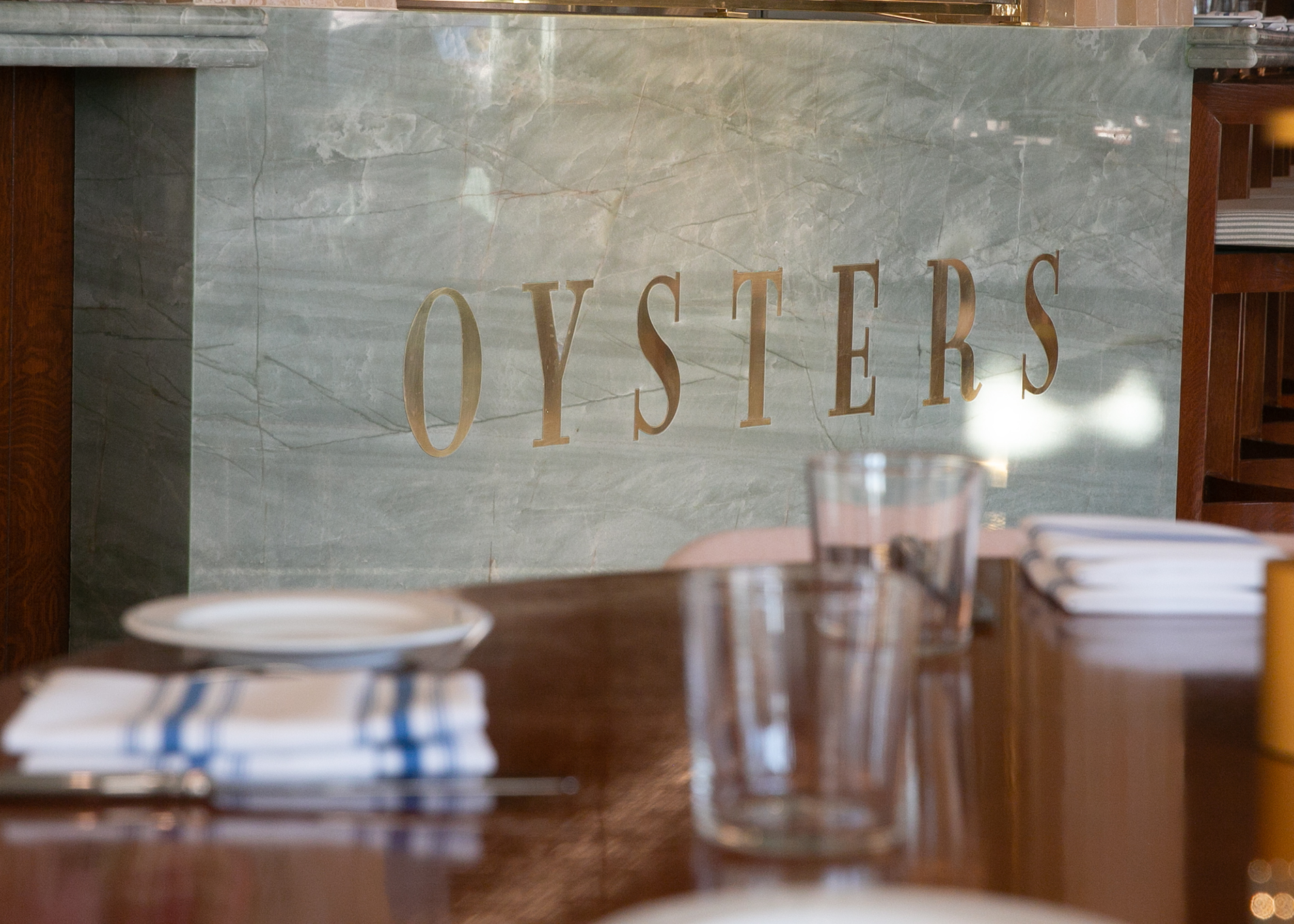 Marble OYSTERS sign at Saltie Girl oyster bar Back Bay Boston